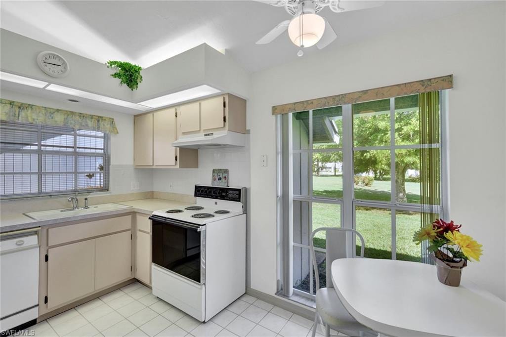 Kitchen and breakfast area overlooking backyard