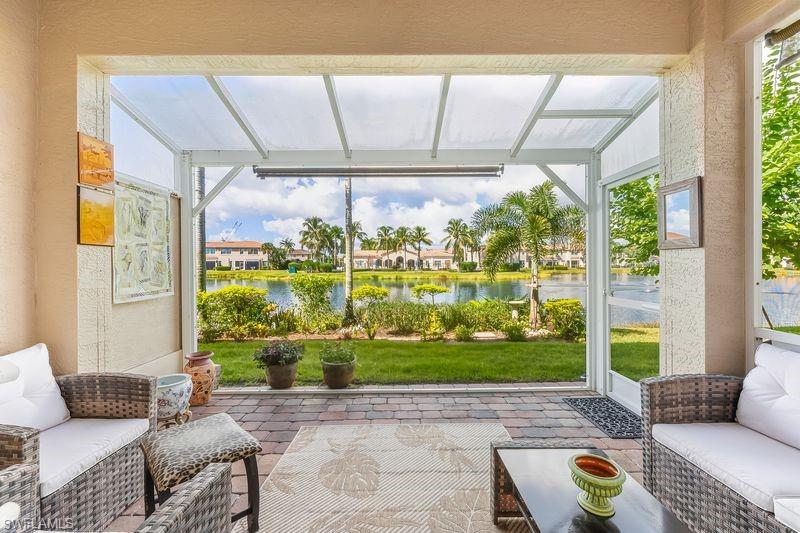 Extended screened lanai with views of community lake and clubhouse
