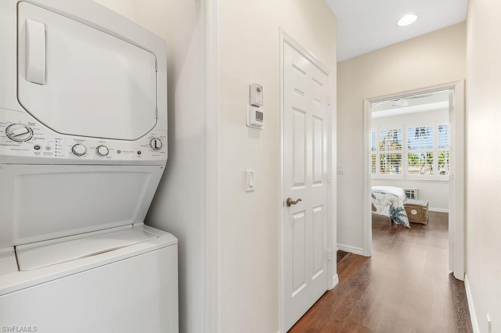 Laundry room located on the second floor hallway with a stacked washer / dryer