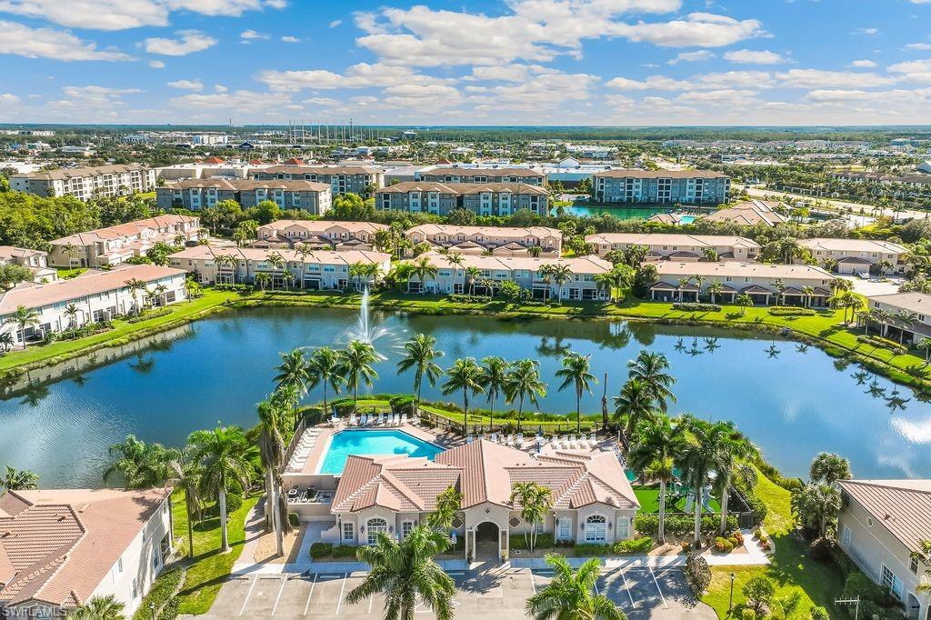 Drone / aerial view of the clubhouse, community pool and amenities