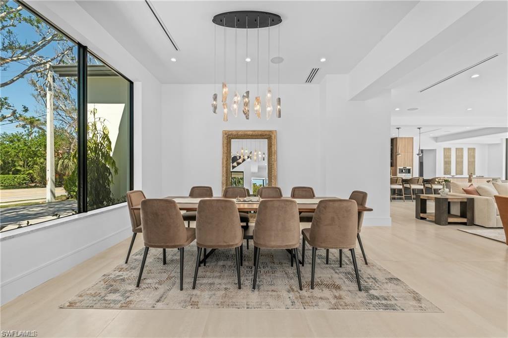Formal Dining space with plenty of natural light, a chandelier, and recessed lighting