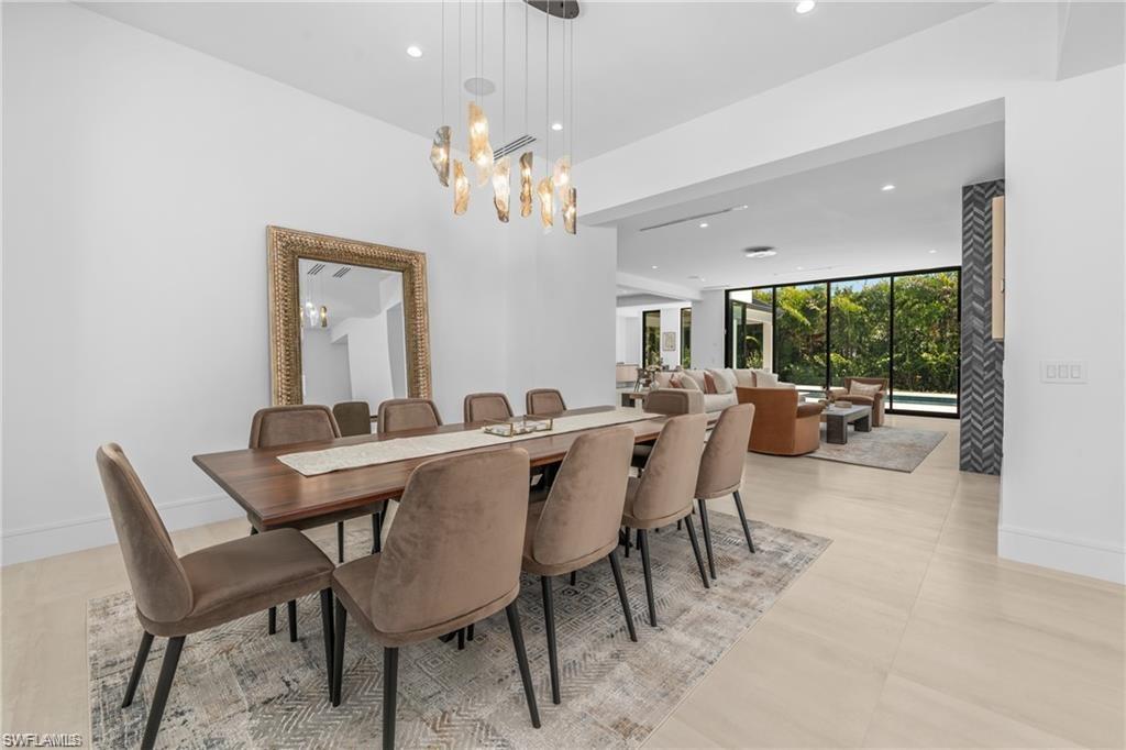 Formal Dining area with recessed lighting and floor to ceiling windows