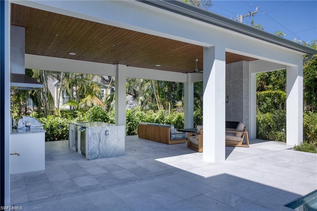 View of patio featuring an outdoor kitchen and an outdoor living space