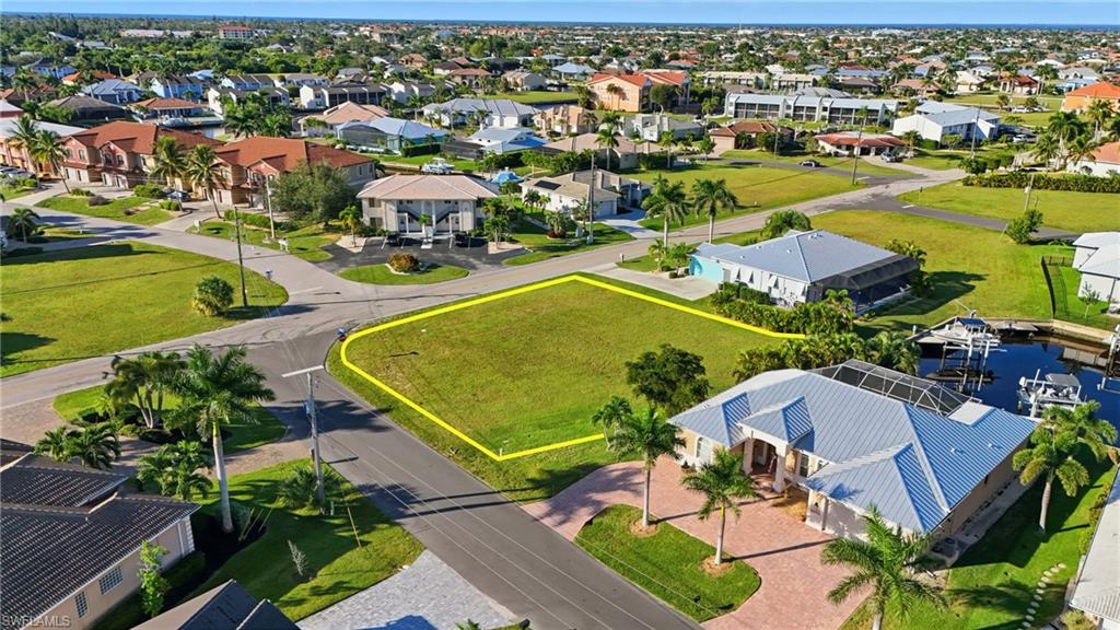 Aerial view of residential area with property boundaries highlighted