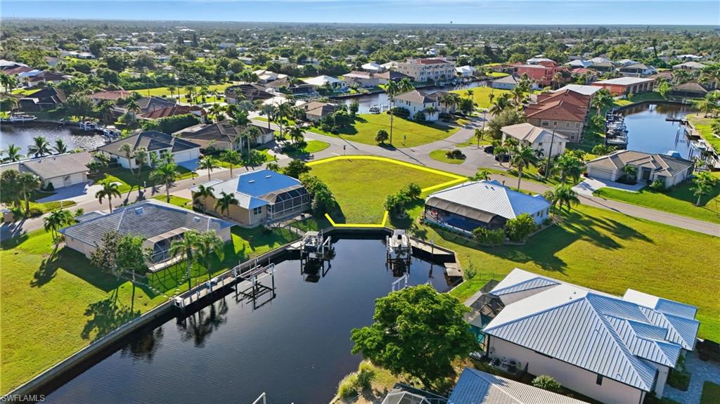 Aerial perspective of suburban area with a large body of water