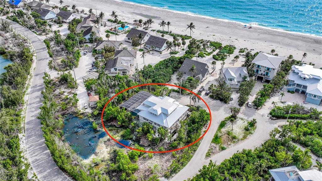 Aerial view of residential area with expansive beach
