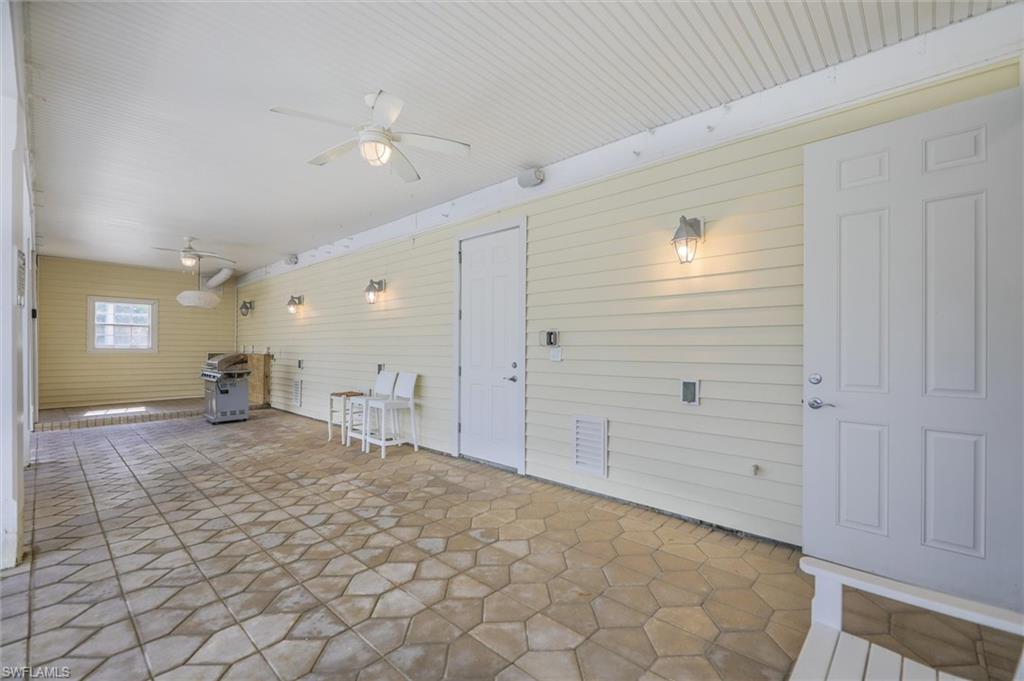 View of patio / terrace with ceiling fan and grilling area
