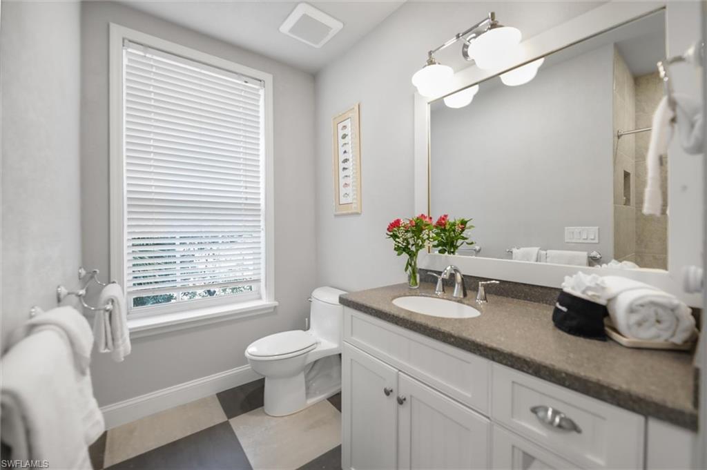 Bathroom with toilet and vanity
