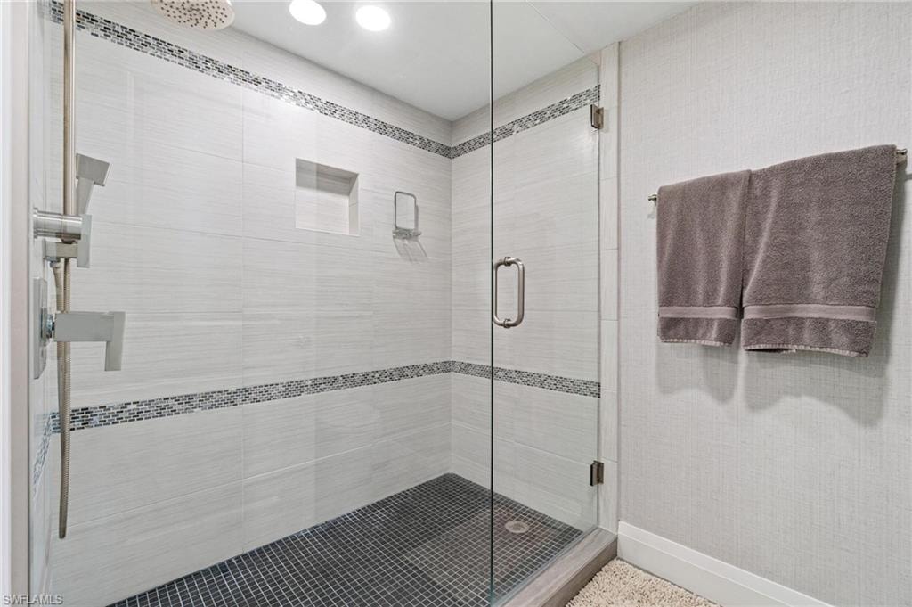Full bath with a stall shower and recessed lighting