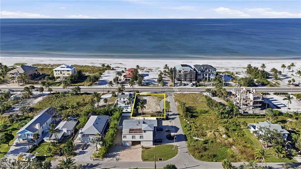 View of property location featuring waterfront with a beach - Virtually Edited Image