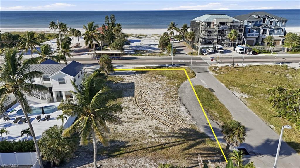 Aerial view of property's location featuring unending shoreline and property boundaries highlighted - Virtually Edited Image