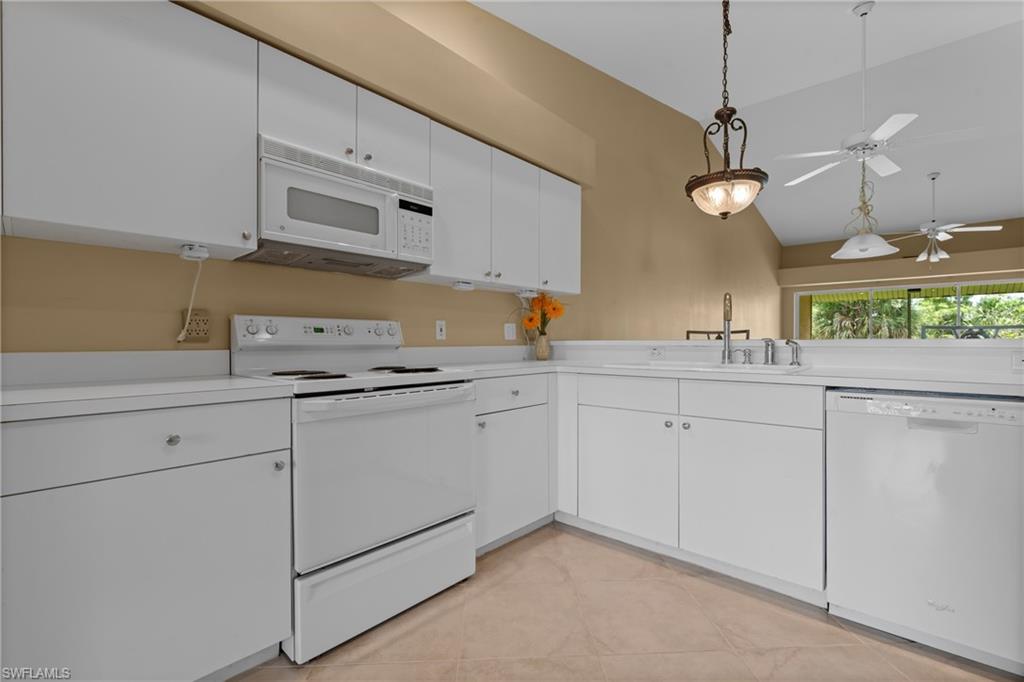 Kitchen featuring white cabinetry, white countertops, built-in microwave, electric range, and dishwasher