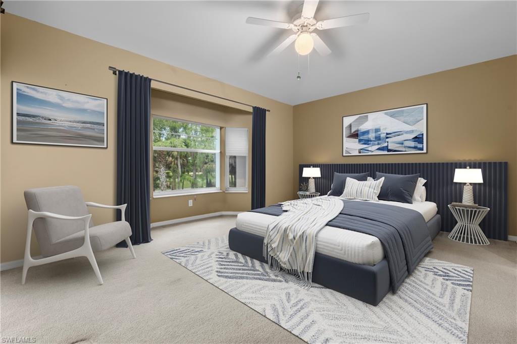 Virtually Staged - Spacious room featuring carpeted flooring, a ceiling fan, and a large window with privacy blinds