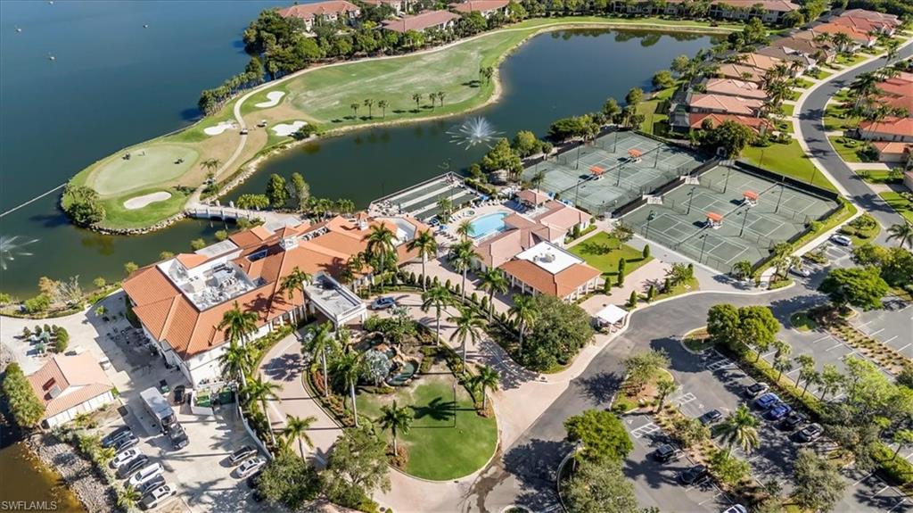 Aerial view of property's location featuring a large body of water and a local golf course