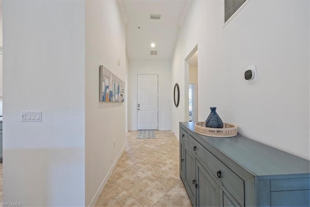 Foyer featuring recessed lighting and light tile patterned flooring