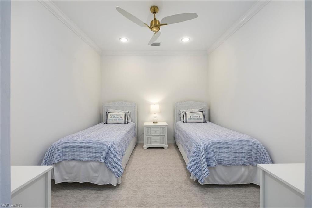 Bedroom featuring light carpet, ornamental molding, a ceiling fan, and recessed lighting and two Twin size beds