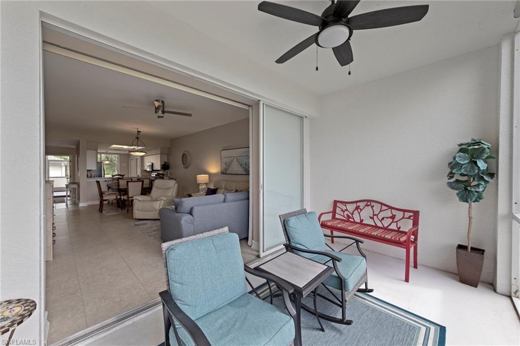 Screened Lanai with golf course view with access from the living room