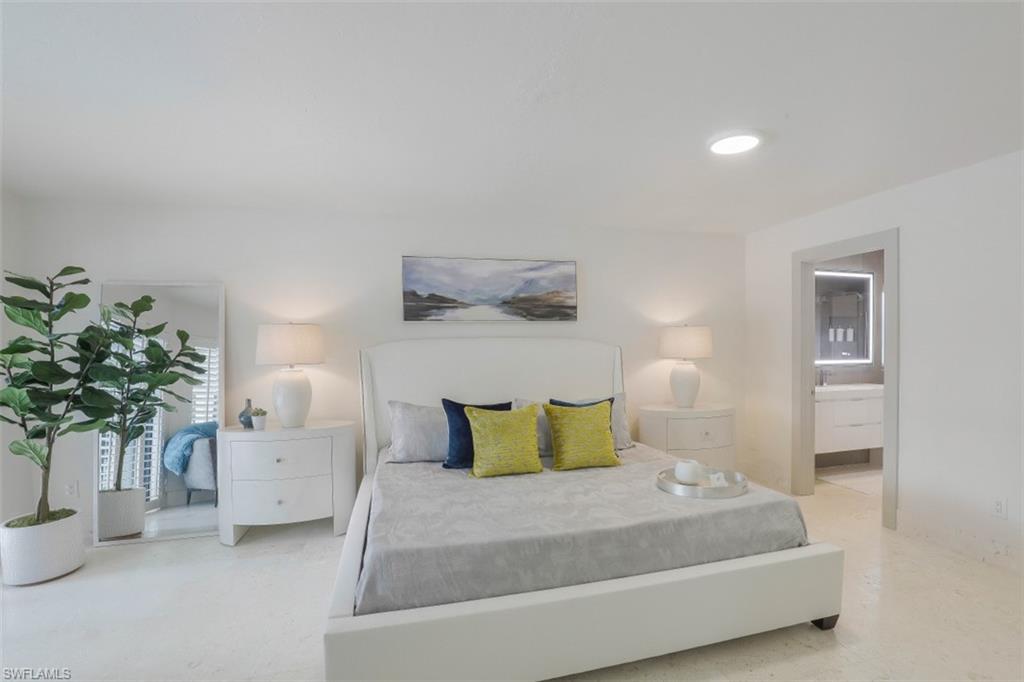 Bedroom featuring ensuite bath and recessed lighting