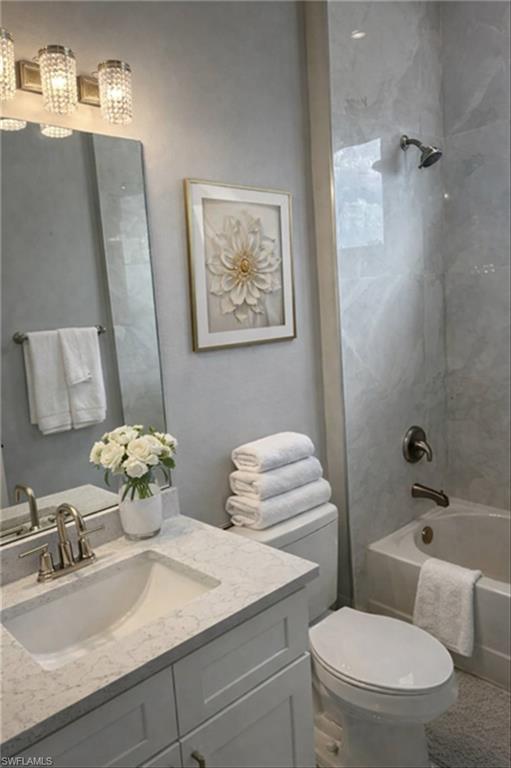 Full bathroom with vanity and shower / washtub combination