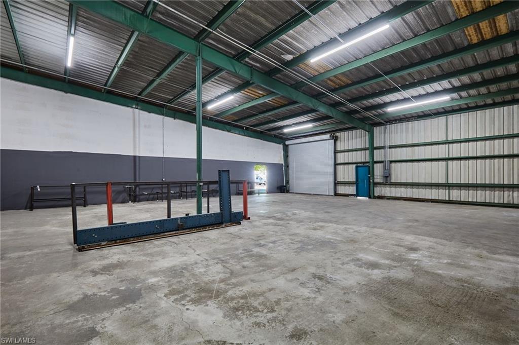 Garage featuring metal wall