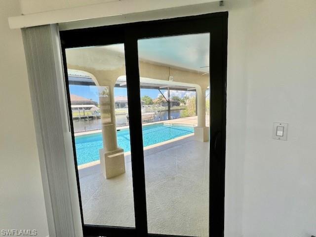 Entryway with a water view and a sunroom