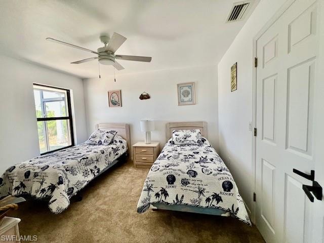Carpeted bedroom with ceiling fan