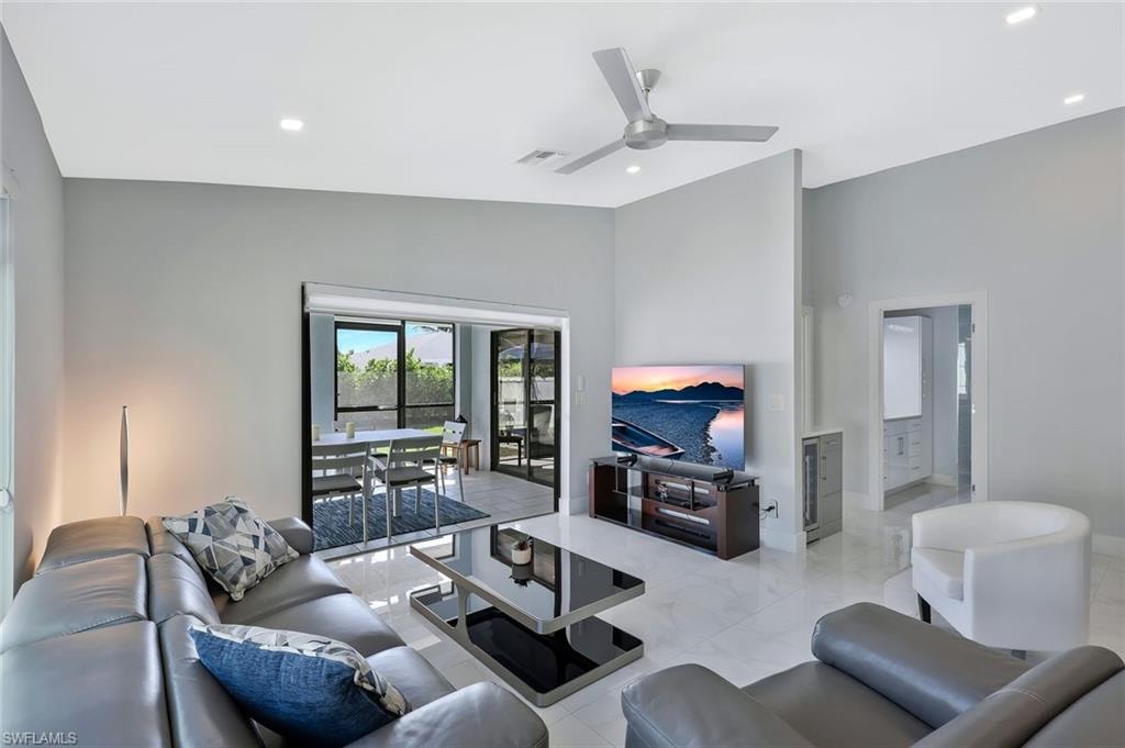 Living area featuring ceiling fan and recessed lighting