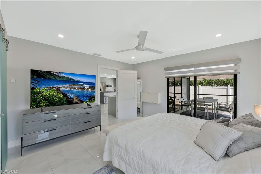 Bedroom featuring access to exterior, ceiling fan, recessed lighting, and light marble finish floors