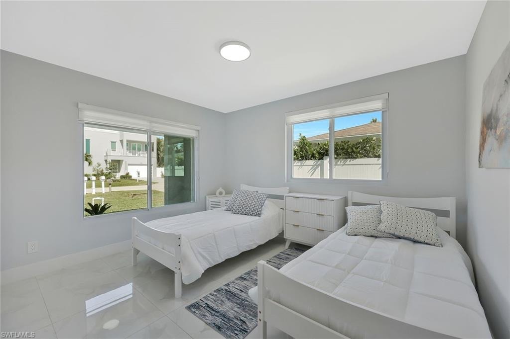 Bedroom with multiple windows