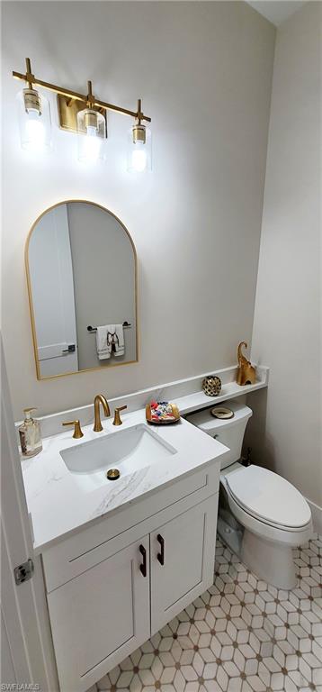 Bathroom with vanity and toilet