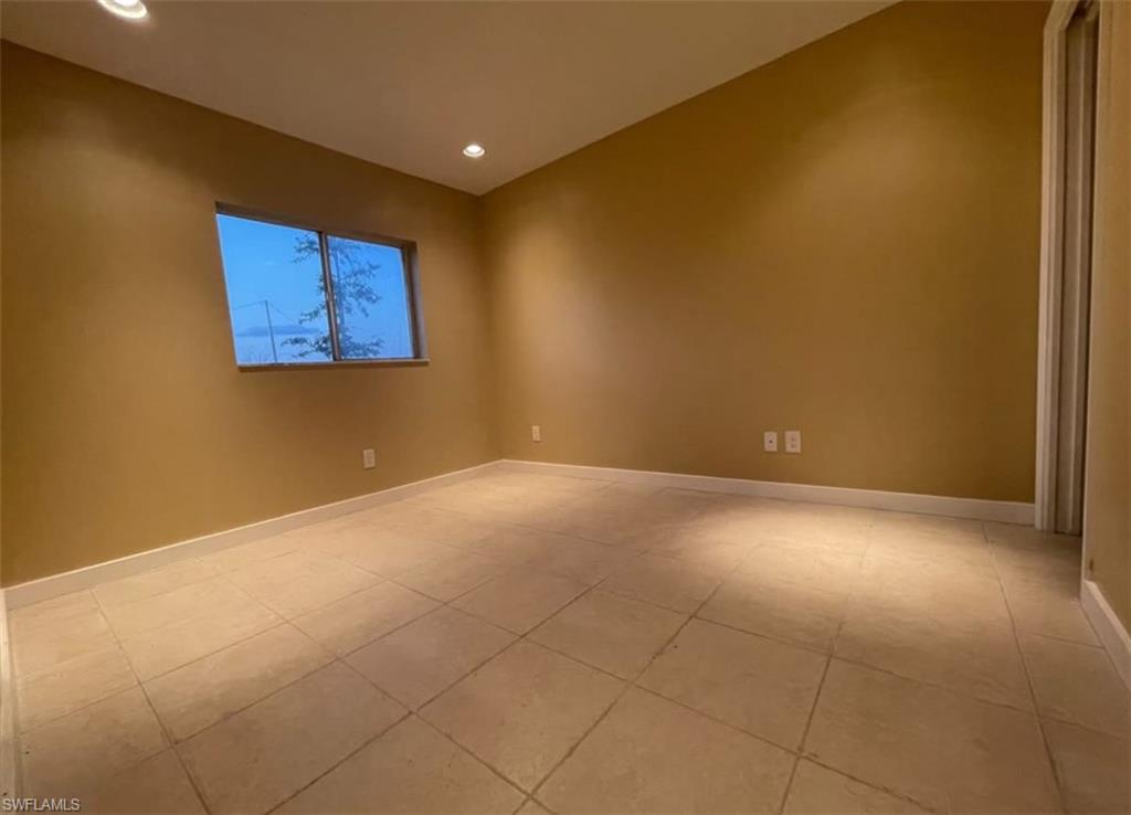 Unfurnished room featuring recessed lighting and light tile patterned floors