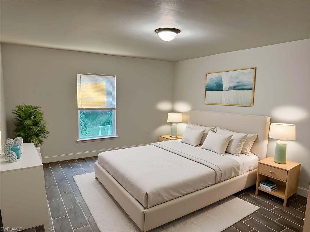 Bedroom with wood finish floors