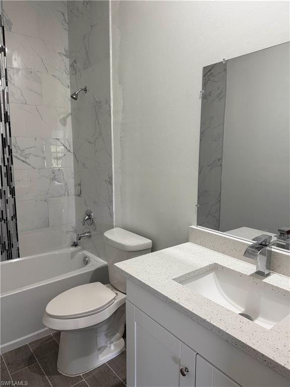 Bathroom featuring vanity and shower / tub combination