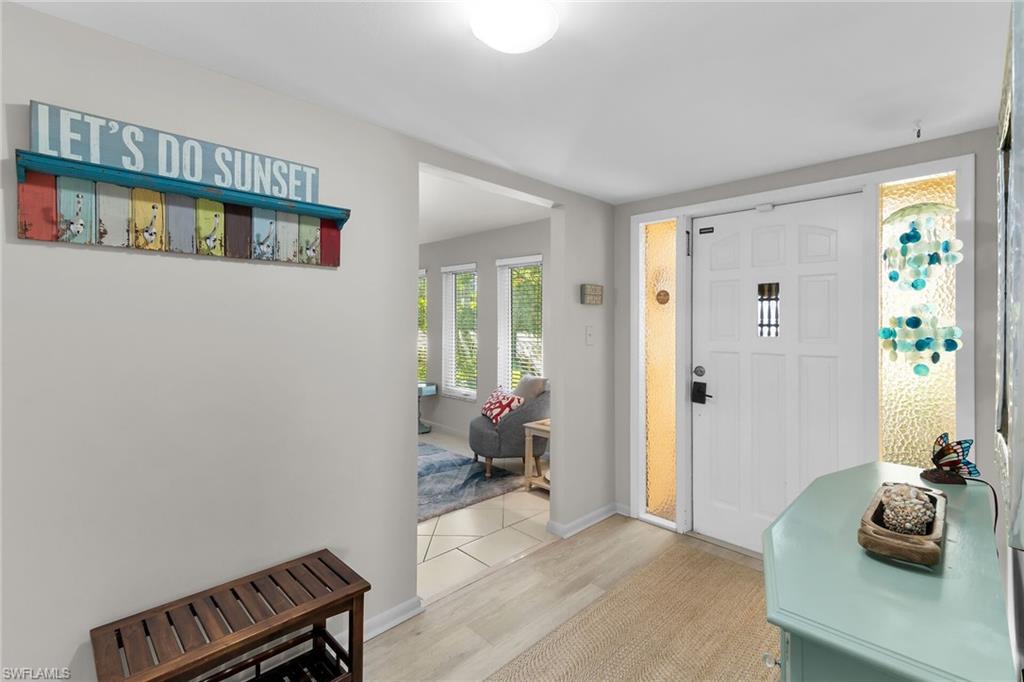 Entrance foyer featuring light wood finished floors and baseboards