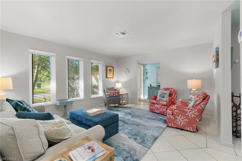 Living area featuring tile patterned flooring and baseboards