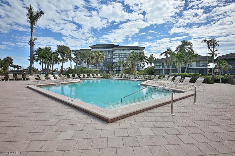 Community pool featuring a patio