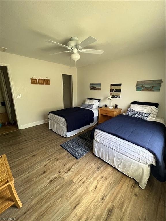 Bedroom with wood finished floors and ceiling fan