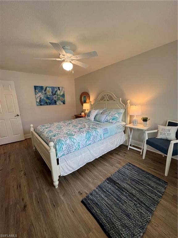 Bedroom featuring dark wood-style floors and a ceiling fan