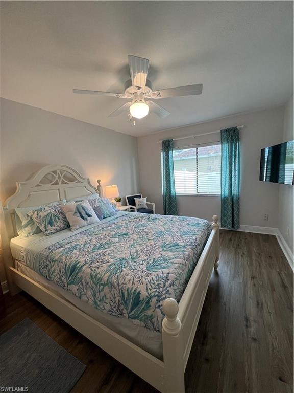 Bedroom featuring dark wood-style floors and ceiling fan