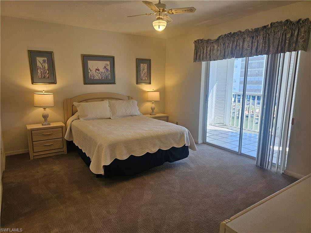 Bedroom featuring access to exterior, carpet floors, and a ceiling fan