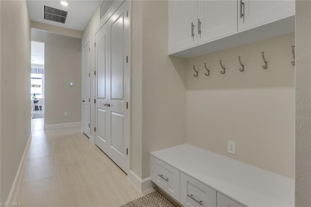 Mudroom with light tile patterned floors