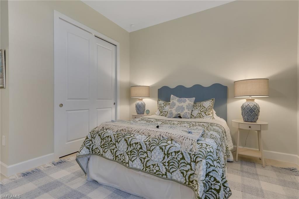 Bedroom with baseboards and a closet