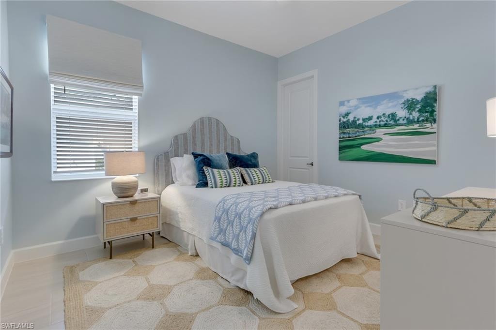 Tiled bedroom with baseboards