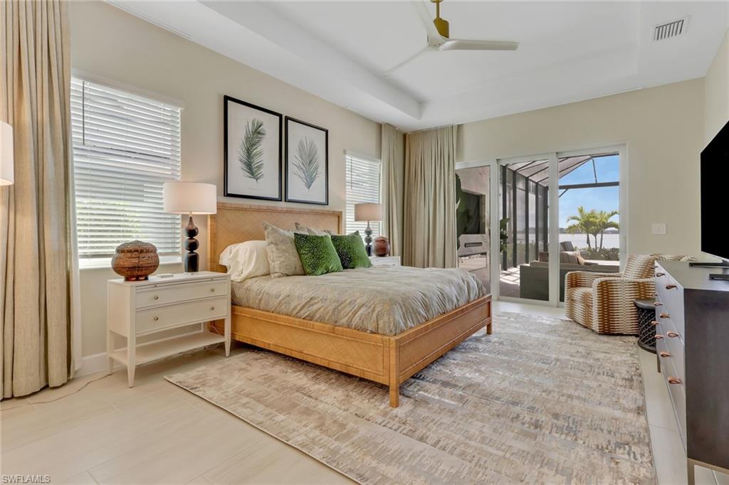 Bedroom with access to outside and ceiling fan