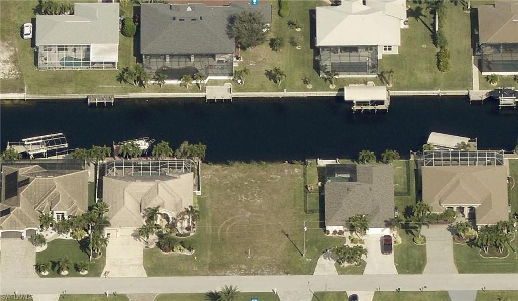 View of property location with nearby suburban area and a nearby body of water