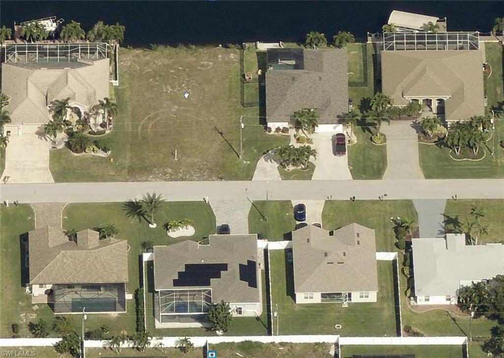 Aerial overview of property's location featuring nearby suburban area