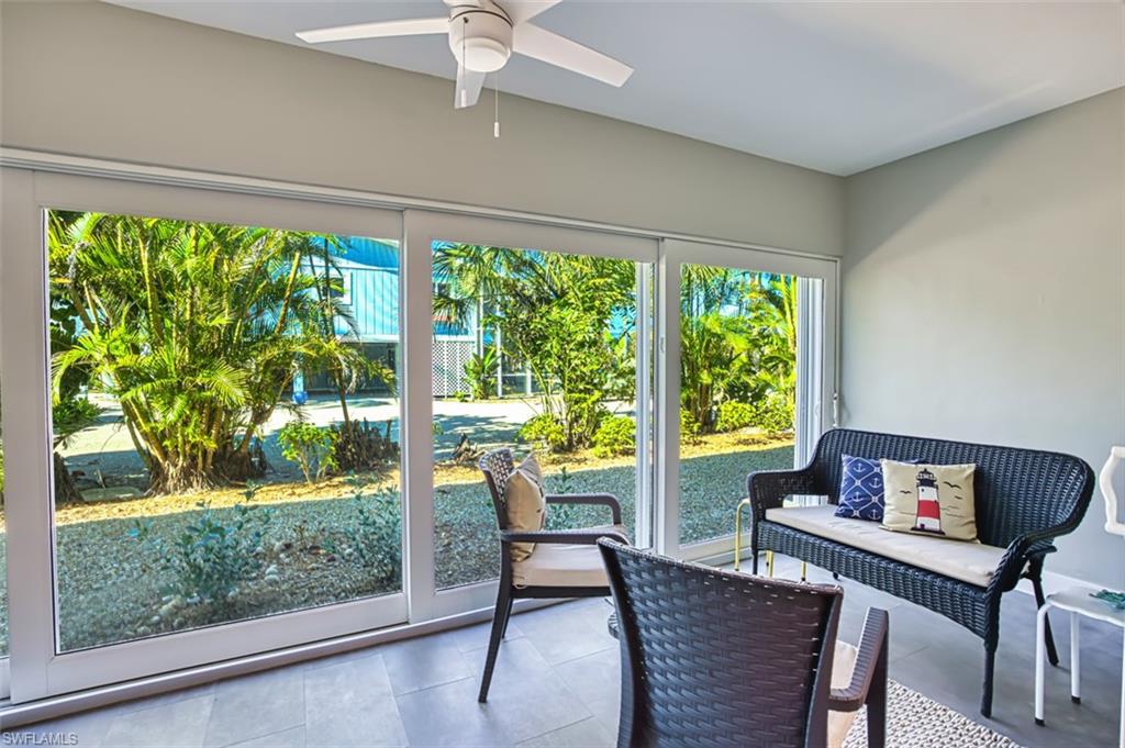 Glass enclosed lanai and tile flooring adding extra living space