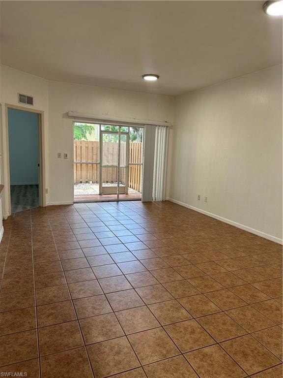 Spare room featuring tile patterned flooring