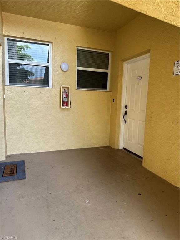 Doorway to property featuring a patio