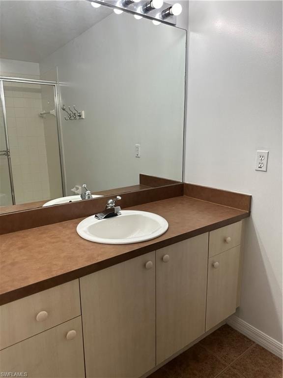Bathroom featuring vanity and tile patterned flooring